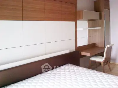 Modern bedroom with stylish wooden furniture and comfortable bed