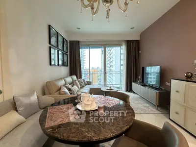 Modern living room with elegant decor and city view from balcony