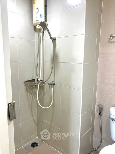 Modern bathroom with sleek shower and tiled walls