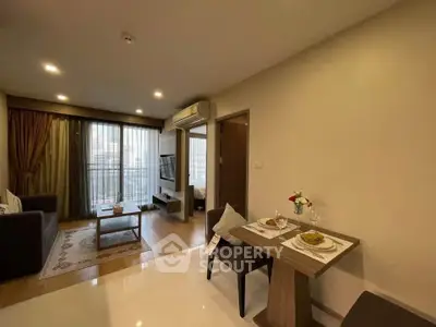 Modern living room with dining area and balcony in stylish apartment