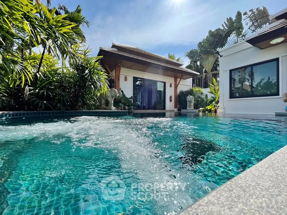 Luxurious villa with private pool and tropical garden, perfect for serene living.