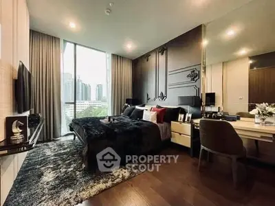 Luxurious bedroom with modern decor and city view, featuring elegant furnishings and ambient lighting.
