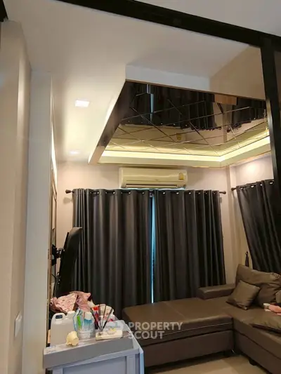 Cozy living room with modern ceiling design and comfortable seating