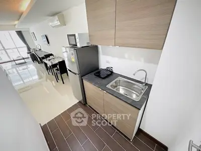 Modern kitchen with sleek appliances and open layout in stylish apartment