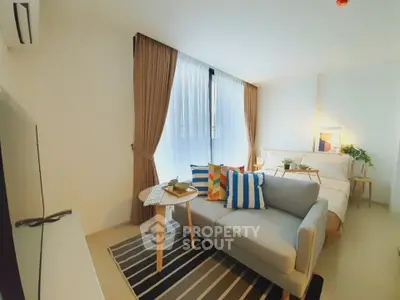 Modern studio apartment with cozy living area and stylish decor