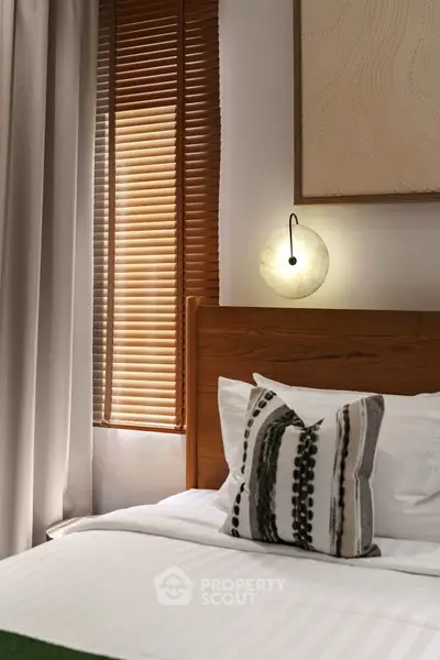 Cozy bedroom with elegant lighting and stylish decor