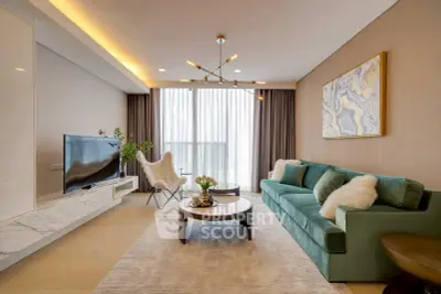 Luxurious living room with modern decor, plush green sofa, and elegant lighting.