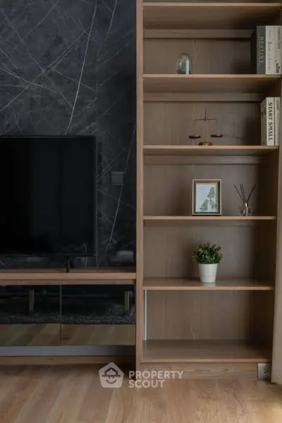 Modern living room with sleek wooden shelves and stylish decor