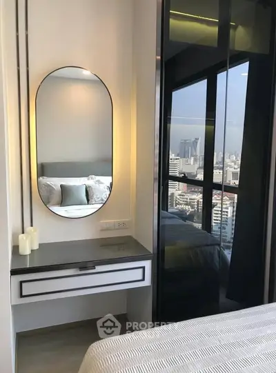 Modern bedroom with city view and stylish vanity mirror