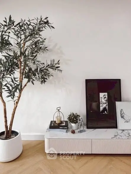 Stylish living room corner with modern decor and indoor plant