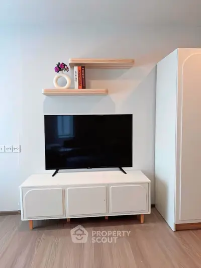 Modern living room with sleek TV stand and floating shelves