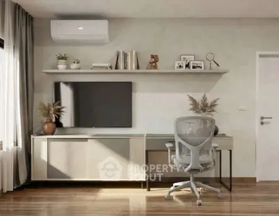Modern study room with sleek desk, ergonomic chair, and wall-mounted TV, perfect for productivity.