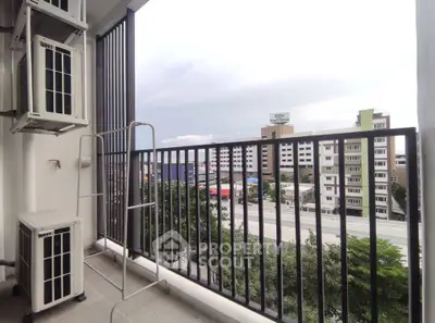 Modern balcony with city view and air conditioning units