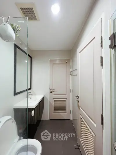 Modern bathroom with sleek design and elegant fixtures in a contemporary home.