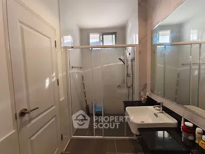 Modern bathroom with sleek design and glass shower enclosure