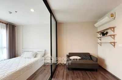 Modern bedroom with glass partition and cozy seating area
