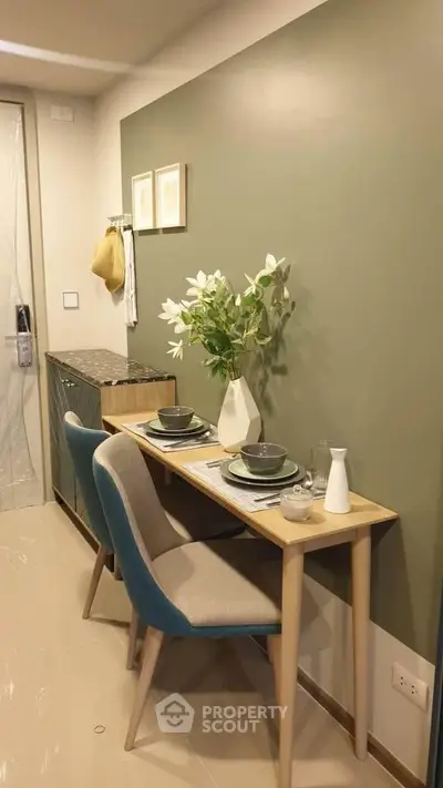 Chic dining nook with modern decor and stylish furniture in a cozy apartment setting.