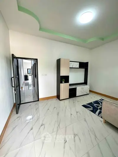 Modern living room with sleek furniture and marble flooring
