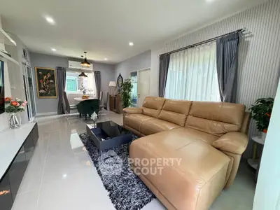 Spacious modern living room with leather sofa and elegant decor