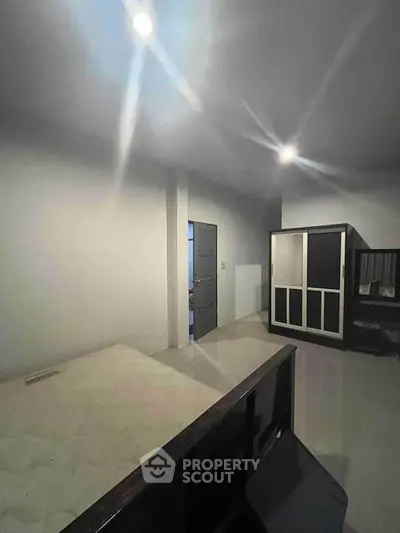 Spacious bedroom with modern wardrobe and sleek design