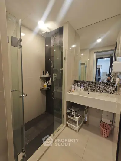 Modern bathroom with glass shower and stylish sink area