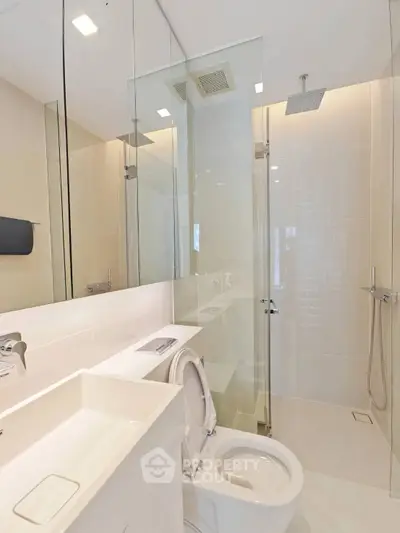 Modern bathroom with sleek shower and elegant fixtures