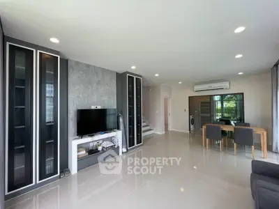 Spacious modern living room with sleek design and ample natural light