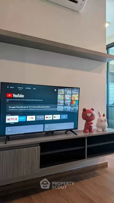 Modern living room with sleek TV setup and stylish decor