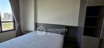 Modern bedroom with city view and sleek design in urban apartment