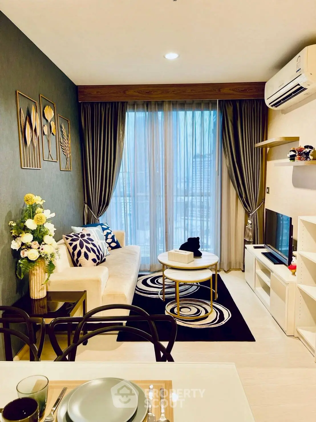 Modern living room with stylish decor and balcony view