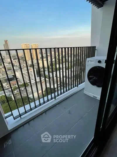 Modern balcony with city view and washing machine, perfect for urban living.