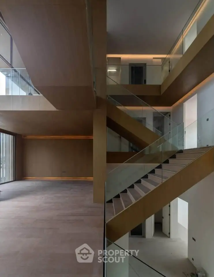 Stunning modern interior with elegant staircase and open layout, perfect for luxury living.