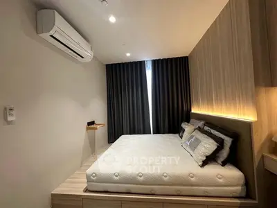 Modern bedroom with stylish decor and built-in air conditioning unit