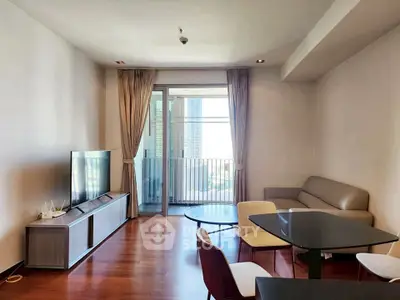 Modern living room with balcony view, sleek furniture, and natural light.
