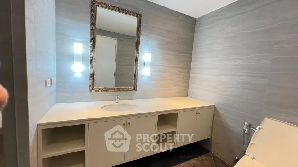 Modern bathroom with sleek vanity and ambient lighting