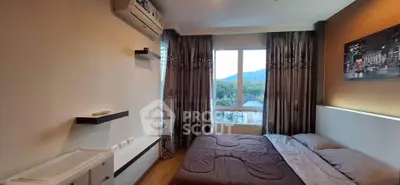 Cozy bedroom with scenic window view and modern decor