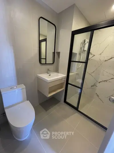 Modern bathroom with sleek design and glass shower enclosure