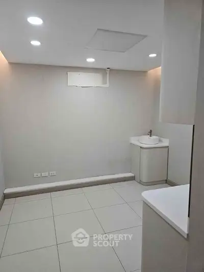 Spacious modern bathroom with sleek fixtures and recessed lighting