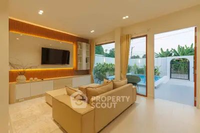 Luxurious living room with pool view, modern decor, and cozy ambiance