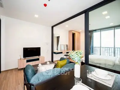 Modern living room with open layout and balcony view in stylish apartment