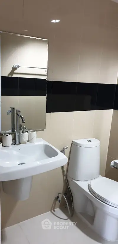 Modern bathroom with sleek fixtures and minimalist design.