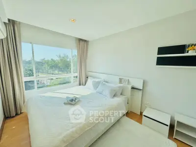 Bright and airy bedroom with large window and modern decor