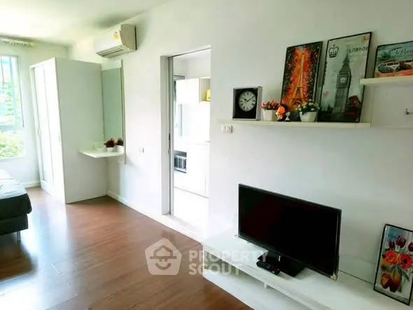Modern living room with sleek wooden flooring and stylish decor