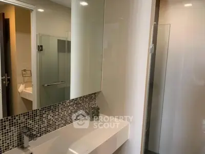 Modern bathroom with sleek design and glass shower enclosure