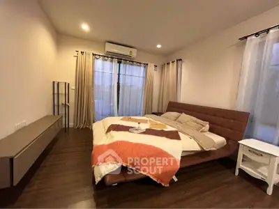 Spacious modern bedroom with cozy lighting and stylish decor