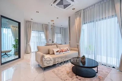 Luxurious modern living room with elegant decor and large windows