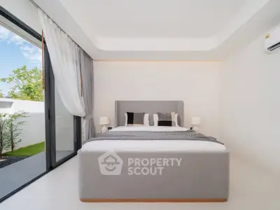 Modern bedroom with large window and minimalist decor in luxury home