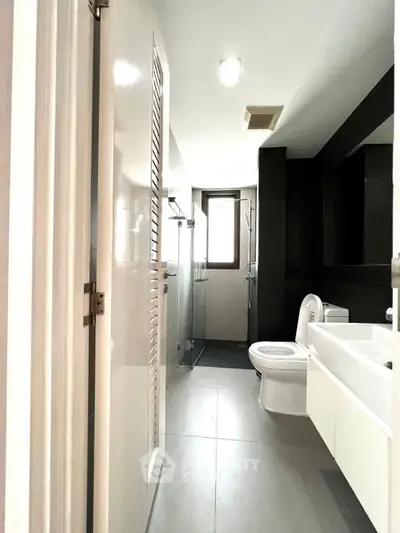 Modern bathroom with sleek design and glass shower enclosure