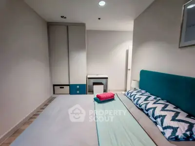 Modern bedroom with stylish decor and ample storage space