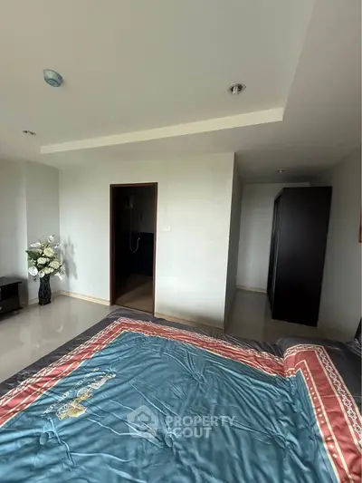 Spacious bedroom with elegant decor and modern furnishings
